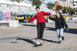 © Victor - Two teens having fun with a skateboard