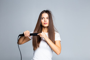 Beautiful woman ceramic hair straightener isolated on white background