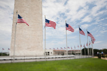 Tilt Shift View Of Flags Beneath The Washington Monument In DC.