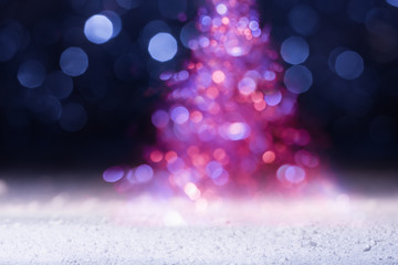 Wall Mural - Defocused holiday lights in the shape of Christmas tree. New Year greeting