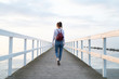 © Johnér - Woman walking on jetty