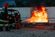 © Javier Pardina/Stocksy - Fireman teacher learning how stop fire