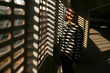 © Dmytro Bilous/Stocksy - portrait of a girl in a light shadow figure and a striped sweater