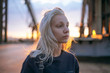 © Dmytro Bilous/Stocksy - Portrait of young woman standing outdoors