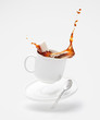 © 365mm/Stocksy - Falling cup with splashing coffee and sugar