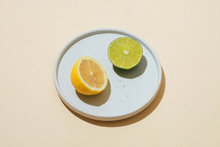Close Up Of Lime And Orange On Plate
