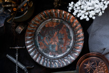 Copper/metal Vintage Kitchen Utensils: Corkscrew, Vase Of Flowers, Napkin Ring, Plate, Knife, Fork, Pan On Black Background. Still Life, Top View