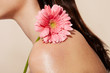© leandro crespi/Stocksy - Skin and flower detail
