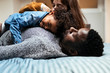 © Santi Nunez/Stocksy - Happy family having fun at home