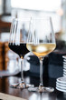 © Pietro Karras/Stocksy - Glasses of red and white wine on table