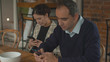 © iaginzburg - Family couple sit side by side with phones in thier hands and talk