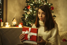 Sad Girl Open Christmas Red Gift Box With X-mas Tree On Background