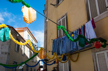 Low Angle View Of Decoration Hanging By Clothesline On Residential Building, Lisbon, Portugal