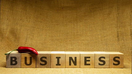 Wall Mural - Wooden cubes with word BUSINESS on sackloth background. Business and bank concept