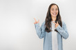 © InsideCreativeHouse - Smiling woman in casual pointing with two fingers isolated over white background