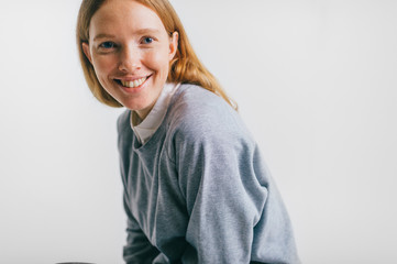 Young beautiful freckles woman face portrait with healthy skin