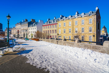 Wall Mural - Cityscape View with City Buildings and White Snow Covered the Ground in Quebec City, Canada