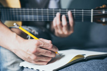 Artist Songwriter Thinking Writing Notes,lyrics In Book At Studio.man Playing Live Acoustic Guitar Relax Chill.concept For Musician Creative.composer Work Process.people Relaxing Time With Instrument