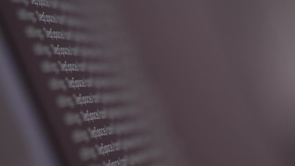 Wall Mural - programming code development scrolling on computer screen 4k