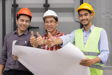 Team of engineers and architect  working with plan   at  construction site  showing thumbs up. Success Teamwork Concept.