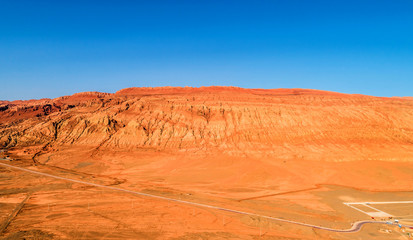 Wall Mural - The Flaming Mountains are barren eroded red sandstone hills in Tian Shan Mountain range Xinjiang China.