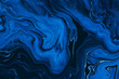 canvas print picture - Hand painted background with mixed liquid blue and golden paints. Classic blue color of the year 2020. Abstract fluid acrylic painting. Marbled blue abstract background. Liquid marble pattern