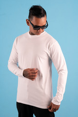 Wall Mural - Black man wearing white long sleeve t-shirt and sunglasses front view