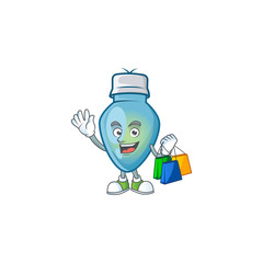 Wall Mural - Cheerful blue christmas bulb cartoon character waving and holding Shopping bags