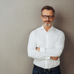 Wall Mural - Man in glasses and white shirt, arms folded
