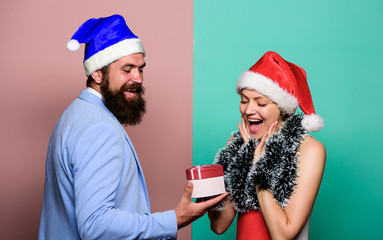 Wall Mural - for you. happy family couple celebrate xmas. santa man and woman with tinsel. merry christmas. winter holidays. celebrate together. happy new year party. gift with love. time for presents