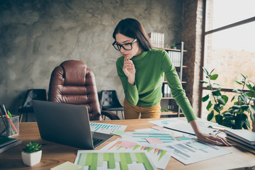 Portrait of her she nice attractive skilled experienced professional focused girl agent broker analyst preparing financial report researching at modern loft industrial interior workplace workstation