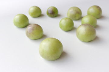 Wall Mural - The tomatillo ,Physalis philadelphica and Physalis ixocarpa, also known as the Mexican ready for cooking. Eaten raw or cooked in a variety of dishes, particularly salsa verde.