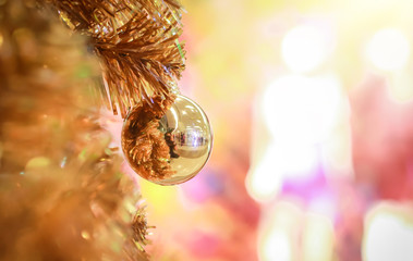 Blurry of Christmas and New Year's balls with beautiful decorations on the Christmas tree, soft light, beautiful background images and illustrations.