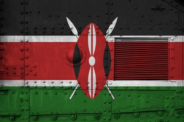 Kenya flag depicted on side part of military armored tank closeup. Army forces conceptual background