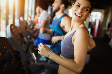 Close up image of attractive fit woman in gym