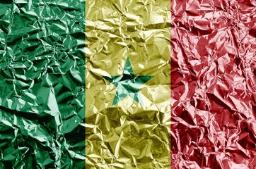 Poster - Senegal flag depicted in paint colors on shiny crumpled aluminium foil closeup. Textured banner on rough background