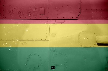 Bolivia flag depicted on side part of military armored helicopter closeup. Army forces aircraft conceptual background