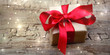 Geschenk Box mit roter Schleife auf rustikalem Holzuntergrund - Weihnachten Hintergrund Banner Geschenk