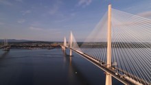 The Queensferry Crossing, The Newer Of The Three Bridges That Spans The River Forth In Scotland. Flying South From North Queensferry, Looking Towards Edinburgh, Shot In The Early Morning After Sunrise