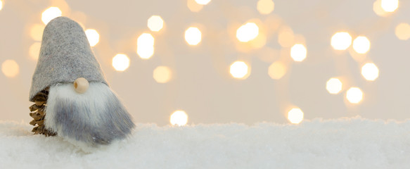 Wall Mural - banner with many different christmas items on white snow with many small, shining lights in the background