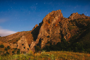 Wall Mural - fantastic starry sky over the mountain range.