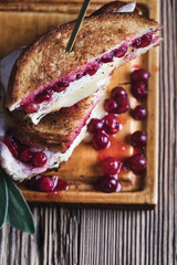 Wall Mural - Thanksgiving turkey sandwich with brie cheese and cranberry sauce