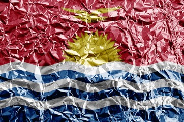 Poster - Kiribati flag depicted in paint colors on shiny crumpled aluminium foil closeup. Textured banner on rough background