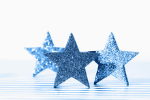 Textured Glittering Blue Stars On White Background. Demonstration Of Color Of The Year.
