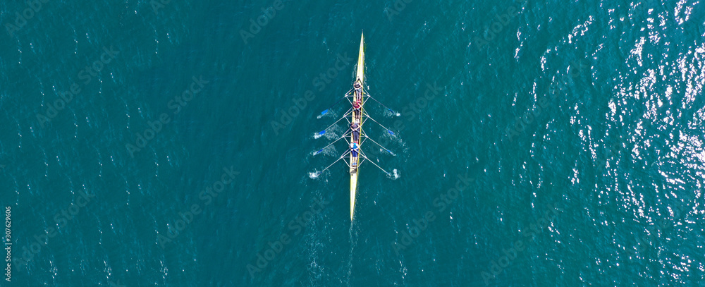 Aerial drone top panoramic view of sport canoe rowing synchronous athletes competing in tropical exotic lake - obrazy, fototapety, plakaty 