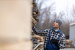 © pikselstock - Young male worker in timber warehouse