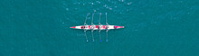 Aerial Drone Top Panoramic View Of Sport Canoe Rowing Synchronous Athletes Competing In Tropical Exotic Lake
