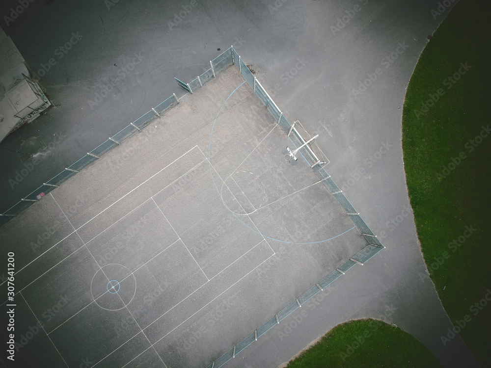 An empty gritty cold urban inner city basketball court photographed An empty gritty cold urban inner city basketball court photographed