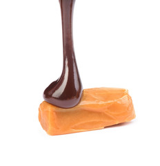 Canvas Print - chocolate poured caramel candy on a white background