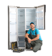 Wall Mural - Male technician with tool box near refrigerator on white background